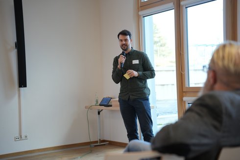 A man speaks into a microphone.